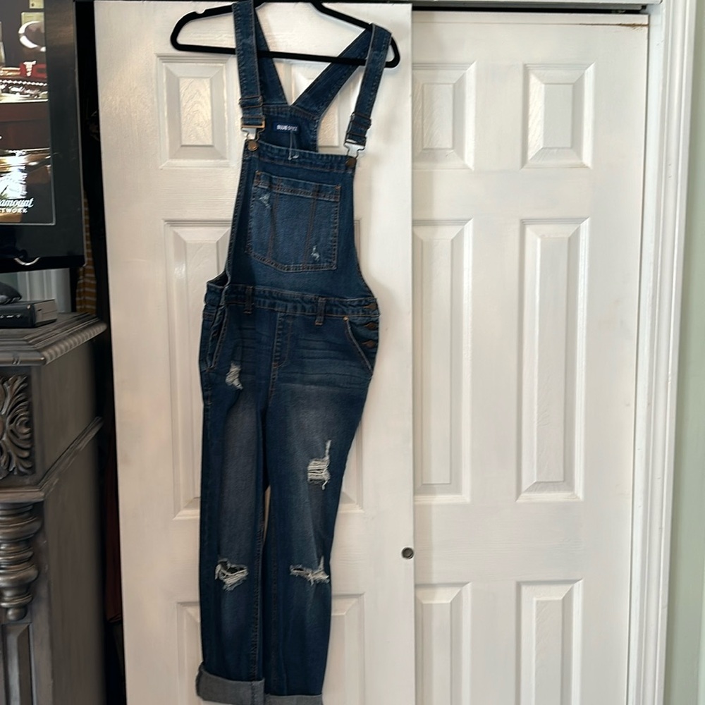 Distressed denim overalls